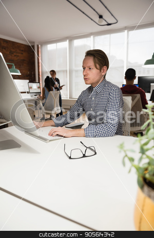 To use this stock image in your creative project, please select the size you need over to the right and click the "Add to Cart" button.
Your downloaded image will come with the Cutcaster watermark removed so don’t worry about the watermark you see on this page. Male executive working on computer in office stock photo, Attentive male executive working on computer in office by Wavebreak Media