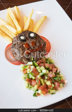 To use this stock image in your creative project, please select the size you need over to the right and click the "Add to Cart" button.
Your downloaded image will come with the Cutcaster watermark removed so don’t worry about the watermark you see on this page. Funny meat cutlet face stock photo, Funny meat cutlet face with french fries as hair and cutted vegetables for children menu by olinchuk