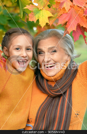 To use this stock image in your creative project, please select the size you need over to the right and click the "Add to Cart" button.
Your downloaded image will come with the Cutcaster watermark removed so don’t worry about the watermark you see on this page. Grandmother and granddaughter having fun stock photo, Portrait of a grandmother and granddaughter having fun outdoors by Ruslan Huzau