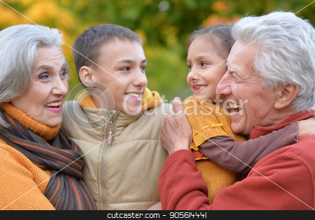 To use this stock image in your creative project, please select the size you need over to the right and click the "Add to Cart" button.
Your downloaded image will come with the Cutcaster watermark removed so don’t worry about the watermark you see on this page. Grandparents and grandchildren outdoors stock photo, Family portrait of grandparents and grandchildren outdoors by Ruslan Huzau
