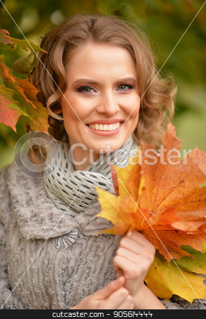 To use this stock image in your creative project, please select the size you need over to the right and click the "Add to Cart" button.
Your downloaded image will come with the Cutcaster watermark removed so don’t worry about the watermark you see on this page. Young woman resting in park stock photo, Beautiful young woman resting in autumnal park by Ruslan Huzau