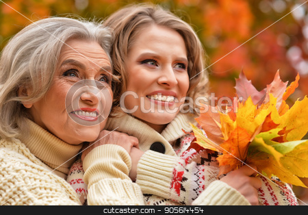 To use this stock image in your creative project, please select the size you need over to the right and click the "Add to Cart" button.
Your downloaded image will come with the Cutcaster watermark removed so don’t worry about the watermark you see on this page. Senior woman with daughter resting stock photo, Senior woman with daughter resting in autumnal park by Ruslan Huzau
