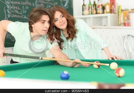 To use this stock image in your creative project, please select the size you need over to the right and click the "Add to Cart" button.
Your downloaded image will come with the Cutcaster watermark removed so don’t worry about the watermark you see on this page. young couple playing billiard stock photo, Portrait of happy young couple playing billiard by Ruslan Huzau