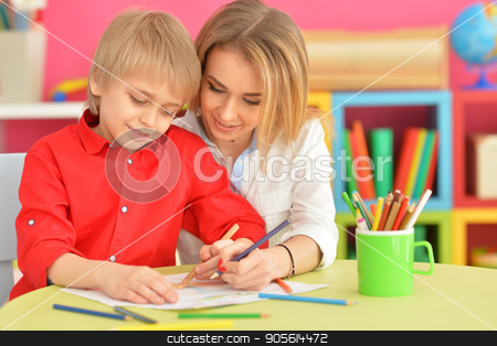 To use this stock image in your creative project, please select the size you need over to the right and click the "Add to Cart" button.
Your downloaded image will come with the Cutcaster watermark removed so don’t worry about the watermark you see on this page. Mother with her son draw with pencils stock photo, Portrait of a mother with her son draw with pencils by Ruslan Huzau