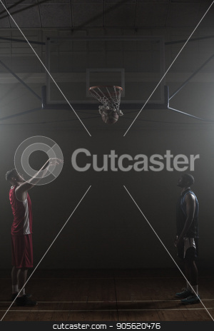 To use this stock image in your creative project, please select the size you need over to the right and click the "Add to Cart" button.
Your downloaded image will come with the Cutcaster watermark removed so don’t worry about the watermark you see on this page. Two basketball player in a gymnasium with one scoring a shoot stock photo, Two basketball player in a gymnasium with one scoring a shoot against a black background by Wavebreak Media