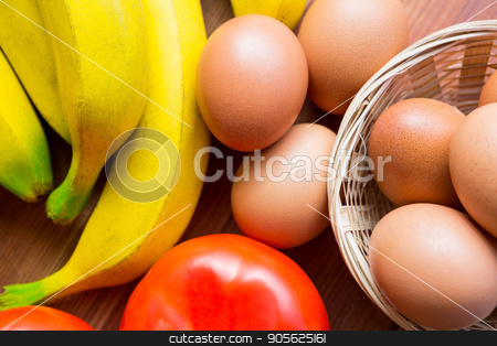 To use this stock image in your creative project, please select the size you need over to the right and click the "Add to Cart" button.
Your downloaded image will come with the Cutcaster watermark removed so don’t worry about the watermark you see on this page. Close-up of fresh tomato, bananas and eggs stock photo, Close-up of fresh tomato, bananas and eggs in supermarket by Wavebreak Media