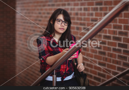 To use this stock image in your creative project, please select the size you need over to the right and click the "Add to Cart" button.
Your downloaded image will come with the Cutcaster watermark removed so don’t worry about the watermark you see on this page. Female student walking on staircase stock photo, Portrait of female student walking on staircase in college by Wavebreak Media