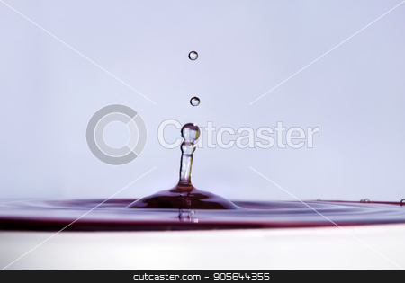To use this stock image in your creative project, please select the size you need over to the right and click the "Add to Cart" button.
Your downloaded image will come with the Cutcaster watermark removed so don’t worry about the watermark you see on this page. Water drop close up stock photo, Water drop falling into water and making droplet splash. Shallow depth of field. Selective focus. Lilac shade water. by Veresovich