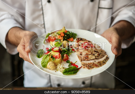 To use this stock image in your creative project, please select the size you need over to the right and click the "Add to Cart" button.
Your downloaded image will come with the Cutcaster watermark removed so don’t worry about the watermark you see on this page. Mature man professional chef cooking meal indoors stock photo, Mature male professional chef cooking meal indoors finished by Dmytro Sidelnikov