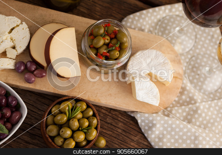 To use this stock image in your creative project, please select the size you need over to the right and click the "Add to Cart" button.
Your downloaded image will come with the Cutcaster watermark removed so don’t worry about the watermark you see on this page. Olives with cheese and vegetable stock photo, High angle view of olives with cheese and vegetable on table by Wavebreak Media