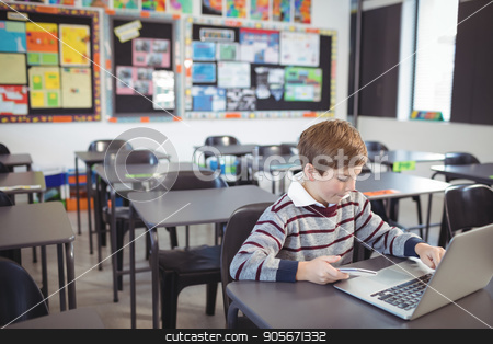 To use this stock image in your creative project, please select the size you need over to the right and click the "Add to Cart" button.
Your downloaded image will come with the Cutcaster watermark removed so don’t worry about the watermark you see on this page. Schoolboy using laptop and mobile phone on desk stock photo, Schoolboy using laptop and mobile phone on desk at classroom by Wavebreak Media