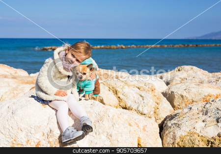 To use this stock image in your creative project, please select the size you need over to the right and click the "Add to Cart" button.
Your downloaded image will come with the Cutcaster watermark removed so don’t worry about the watermark you see on this page. Child with little dog stock photo, Child with little dog playing outdoor in summer by Satura86
