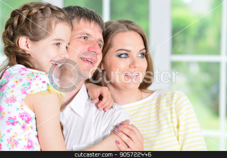 To use this stock image in your creative project, please select the size you need over to the right and click the "Add to Cart" button.
Your downloaded image will come with the Cutcaster watermark removed so don’t worry about the watermark you see on this page. girl posing with her parents stock photo, Close up portrait of cute little girl posing with her parents by Ruslan Huzau