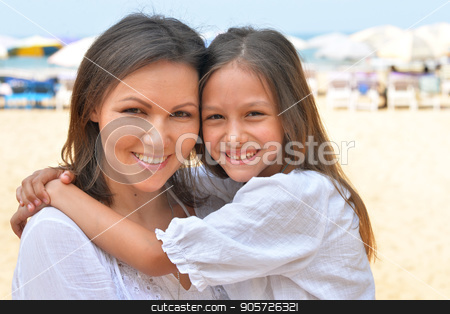 To use this stock image in your creative project, please select the size you need over to the right and click the "Add to Cart" button.
Your downloaded image will come with the Cutcaster watermark removed so don’t worry about the watermark you see on this page. Mother hugging little daughter stock photo, Mother hugging her cute little daughter on seashore by Ruslan Huzau