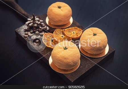 To use this stock image in your creative project, please select the size you need over to the right and click the "Add to Cart" button.
Your downloaded image will come with the Cutcaster watermark removed so don’t worry about the watermark you see on this page. Tasty dessert for xmas stock photo, Tasty dessert as orange fruit with chocolate fir-tree by olinchuk
