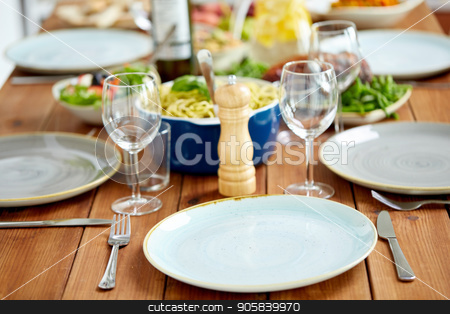 To use this stock image in your creative project, please select the size you need over to the right and click the "Add to Cart" button.
Your downloaded image will come with the Cutcaster watermark removed so don’t worry about the watermark you see on this page. table served with plates, wine glasses and food stock photo, catering and eating concept - table served with plates, wine glasses and food by Syda Productions