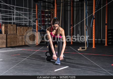 To use this stock image in your creative project, please select the size you need over to the right and click the "Add to Cart" button.
Your downloaded image will come with the Cutcaster watermark removed so don’t worry about the watermark you see on this page. Athletic girl ready to start exercises with a kettlebell at the gym stock photo, Determined athletic girl ready to start exercises with a kettlebell at the gym by Federico Caputo