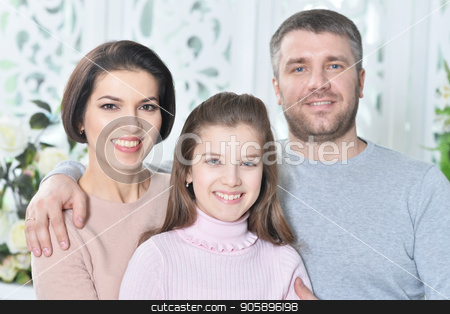 To use this stock image in your creative project, please select the size you need over to the right and click the "Add to Cart" button.
Your downloaded image will come with the Cutcaster watermark removed so don’t worry about the watermark you see on this page. Close up portrait of cute little girl with her parents stock photo, Close up portrait of cute little girl with her parents posing by Ruslan Huzau