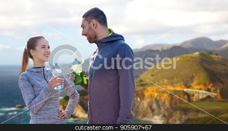 To use this stock image in your creative project, please select the size you need over to the right and click the "Add to Cart" button.
Your downloaded image will come with the Cutcaster watermark removed so don’t worry about the watermark you see on this page. couple of sportsmen with water over big sur coast stock photo, fitness, sport and people concept - smiling couple with bottles of water over bixby creek bridge on big sur coast of california background by Syda Productions