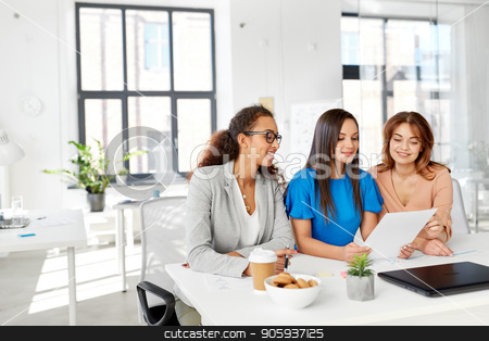 To use this stock image in your creative project, please select the size you need over to the right and click the "Add to Cart" button.
Your downloaded image will come with the Cutcaster watermark removed so don’t worry about the watermark you see on this page. businesswomen discussing papers at office stock photo, business, teamwork and people concept - female team or businesswomen discussing papers at office by Syda Productions