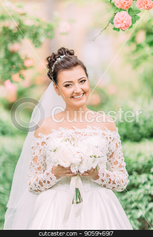 To use this stock image in your creative project, please select the size you need over to the right and click the "Add to Cart" button.
Your downloaded image will come with the Cutcaster watermark removed so don’t worry about the watermark you see on this page. Close-up outdoor portrait of the cheerful bride with the wedding bouquet. stock photo, Close-up outdoor portrait of the cheerful bride with the wedding bouquet by Andrii Kobryn
