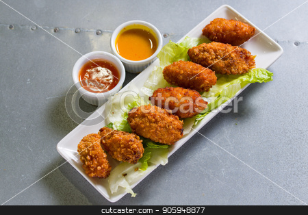 To use this stock image in your creative project, please select the size you need over to the right and click the "Add to Cart" button.
Your downloaded image will come with the Cutcaster watermark removed so don’t worry about the watermark you see on this page. Close up shot of chicken wings stock photo, Close up shot of brown crispy chicken wings by Shane Maritch