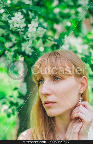 To use this stock image in your creative project, please select the size you need over to the right and click the "Add to Cart" button.
Your downloaded image will come with the Cutcaster watermark removed so don’t worry about the watermark you see on this page. Portrait of a girl on a background of green foliage stock photo, Portrait of a girl on a background of green foliage by aaalll3110