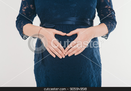 To use this stock image in your creative project, please select the size you need over to the right and click the "Add to Cart" button.
Your downloaded image will come with the Cutcaster watermark removed so don’t worry about the watermark you see on this page. pregnant woman holding hands heart shaped on belly on a white background stock photo, pregnant woman holding hands on belly on a white background by aaalll3110