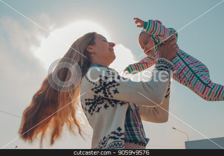 To use this stock image in your creative project, please select the size you need over to the right and click the "Add to Cart" button.
Your downloaded image will come with the Cutcaster watermark removed so don’t worry about the watermark you see on this page. A long-haired woman in a knitted sweater holds a little child in a color striped suit against the blue sky and the sun. Girl with long blonde hair circling her newborn baby stock photo, A long-haired woman in a knitted sweater holds a little child in a color striped suit against the blue sky and the sun. Girl with long blonde hair circling her newborn baby by aaalll3110
