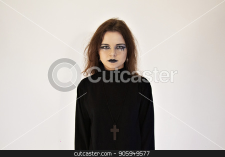 To use this stock image in your creative project, please select the size you need over to the right and click the "Add to Cart" button.
Your downloaded image will come with the Cutcaster watermark removed so don’t worry about the watermark you see on this page. Girl with bright makeup in black suit and with cross on chest on white wall background. Pretty woman in black clothes. Young woman with black lips and red hair stock photo, Girl with bright makeup in black suit and with cross on chest on white wall background. Pretty woman in black clothes. Young woman with black lips and red hair by aaalll3110