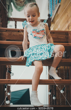 To use this stock image in your creative project, please select the size you need over to the right and click the "Add to Cart" button.
Your downloaded image will come with the Cutcaster watermark removed so don’t worry about the watermark you see on this page. a little blond girl in a white and blue dress in polka dots and light socks descends a wooden ladder crawling stock photo, a little blond girl in a white and blue dress in polka dots and light socks descends a wooden ladder crawling by aaalll3110