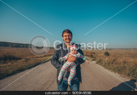 To use this stock image in your creative project, please select the size you need over to the right and click the "Add to Cart" button.
Your downloaded image will come with the Cutcaster watermark removed so don’t worry about the watermark you see on this page. A man with a child in his arms on the road in the middle of a wasteland stock photo, A man with a child in his arms on the road in the middle of a wasteland by aaalll3110