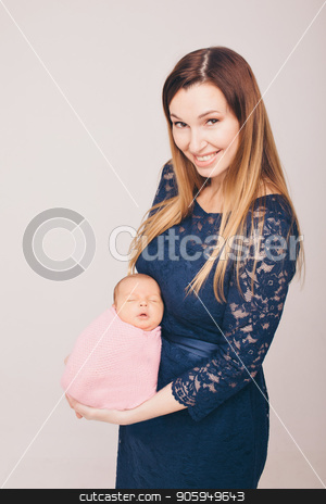To use this stock image in your creative project, please select the size you need over to the right and click the "Add to Cart" button.
Your downloaded image will come with the Cutcaster watermark removed so don’t worry about the watermark you see on this page. baby on the hands of mother. woman and child stock photo, baby on the hands of mother. woman and child by aaalll3110