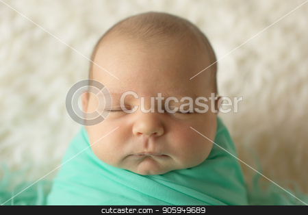 To use this stock image in your creative project, please select the size you need over to the right and click the "Add to Cart" button.
Your downloaded image will come with the Cutcaster watermark removed so don’t worry about the watermark you see on this page. A little child in a greeen diaper lies on a beige background stock photo, A little child in a greeen diaper lies on a beige background by aaalll3110