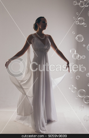 To use this stock image in your creative project, please select the size you need over to the right and click the "Add to Cart" button.
Your downloaded image will come with the Cutcaster watermark removed so don’t worry about the watermark you see on this page. girl in white and with raised hands, attached to the floor dresses. the bride in a dress in Greek style. brunette in pearl jewelry lowered her head. The woman looks like a bird or a bat stock photo, girl in white and with raised hands, attached to the floor dresses. the bride in a dress in Greek style. brunette in pearl jewelry lowered her head. The woman looks like a bird or a bat by aaalll3110
