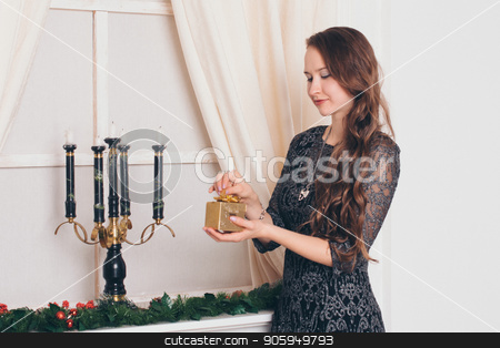 To use this stock image in your creative project, please select the size you need over to the right and click the "Add to Cart" button.
Your downloaded image will come with the Cutcaster watermark removed so don’t worry about the watermark you see on this page. beautiful girl with long hair opens a gift box on white background stock photo, beautiful girl with long hair opens a gift box on white background by aaalll3110