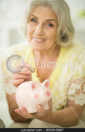 To use this stock image in your creative project, please select the size you need over to the right and click the "Add to Cart" button.
Your downloaded image will come with the Cutcaster watermark removed so don’t worry about the watermark you see on this page. old woman with piggy bank stock photo, portrait of happy beautiful old woman putting coin into piggy bank by Ruslan Huzau