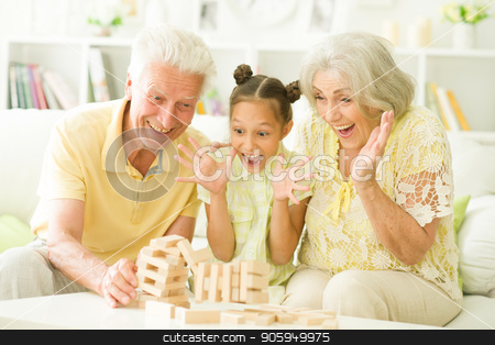 To use this stock image in your creative project, please select the size you need over to the right and click the "Add to Cart" button.
Your downloaded image will come with the Cutcaster watermark removed so don’t worry about the watermark you see on this page. grandparents and granddaughter with wooden blocks stock photo, grandparents and granddaughter sitting at table and playing with wooden blocks by Ruslan Huzau