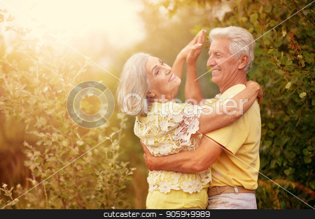 To use this stock image in your creative project, please select the size you need over to the right and click the "Add to Cart" button.
Your downloaded image will come with the Cutcaster watermark removed so don’t worry about the watermark you see on this page. happy mature couple stock photo, happy senior couple smiling and dancing outdoors by Ruslan Huzau