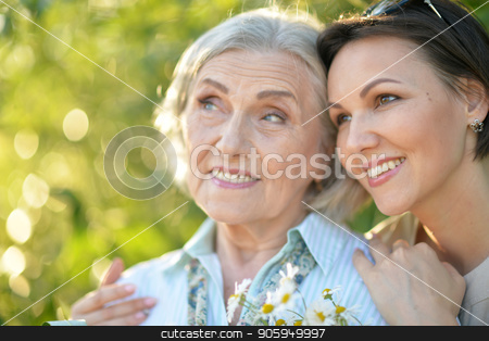 To use this stock image in your creative project, please select the size you need over to the right and click the "Add to Cart" button.
Your downloaded image will come with the Cutcaster watermark removed so don’t worry about the watermark you see on this page. cheerful mother and adult daughter stock photo, Happy senior mother and adult daughter posing together outdoors by Ruslan Huzau