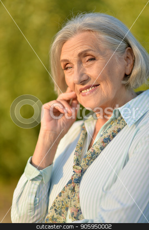 To use this stock image in your creative project, please select the size you need over to the right and click the "Add to Cart" button.
Your downloaded image will come with the Cutcaster watermark removed so don’t worry about the watermark you see on this page. Happy elderly woman posing stock photo, Portrait of happy beautiful elderly woman posing outdoors by Ruslan Huzau