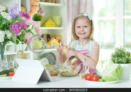 To use this stock image in your creative project, please select the size you need over to the right and click the "Add to Cart" button.
Your downloaded image will come with the Cutcaster watermark removed so don’t worry about the watermark you see on this page. Cute little girl spicing salad on kitchen table stock photo, Cute little girl spicing salad on kitchen table with tablet at home by Ruslan Huzau