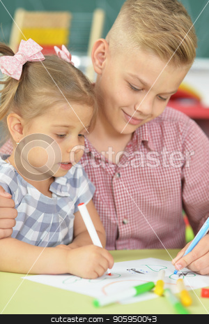 To use this stock image in your creative project, please select the size you need over to the right and click the "Add to Cart" button.
Your downloaded image will come with the Cutcaster watermark removed so don’t worry about the watermark you see on this page. Smiling brother and sister drawing with felt pens stock photo, Smiling brother and sister drawing with felt pens together indoors by Ruslan Huzau