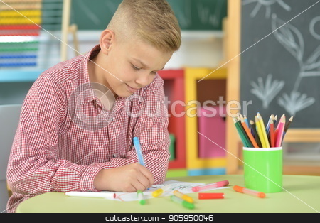 To use this stock image in your creative project, please select the size you need over to the right and click the "Add to Cart" button.
Your downloaded image will come with the Cutcaster watermark removed so don’t worry about the watermark you see on this page. cute boy drawing stock photo, cute boy drawing with pencils in classroom by Ruslan Huzau