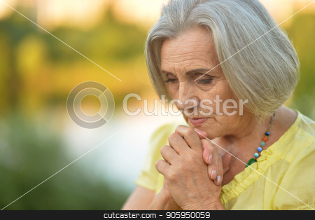 To use this stock image in your creative project, please select the size you need over to the right and click the "Add to Cart" button.
Your downloaded image will come with the Cutcaster watermark removed so don’t worry about the watermark you see on this page. Portrait of beautiful sad senior woman stock photo, Portrait of beautiful sad senior woman in summer park by Ruslan Huzau