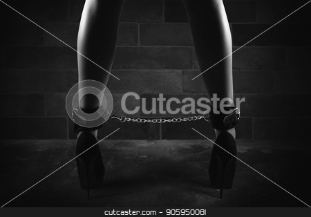 To use this stock image in your creative project, please select the size you need over to the right and click the "Add to Cart" button.
Your downloaded image will come with the Cutcaster watermark removed so don’t worry about the watermark you see on this page. Sensual provocation of a sexy bdsm woman with chained legs stock photo, Sensual provocation of a sexy bdsm woman in lingerie with chained legs by Federico Caputo
