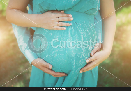 To use this stock image in your creative project, please select the size you need over to the right and click the "Add to Cart" button.
Your downloaded image will come with the Cutcaster watermark removed so don’t worry about the watermark you see on this page. Pregnant woman in blue dress on flowers background stock photo, Pregnant woman in blue dress on flowers background by aaalll3110