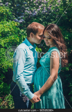 To use this stock image in your creative project, please select the size you need over to the right and click the "Add to Cart" button.
Your downloaded image will come with the Cutcaster watermark removed so don’t worry about the watermark you see on this page. Man hugs his pregnant woman from behind standing in the forest stock photo, Man hugs his pregnant woman from behind standing in the forest by aaalll3110