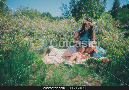 To use this stock image in your creative project, please select the size you need over to the right and click the "Add to Cart" button.
Your downloaded image will come with the Cutcaster watermark removed so don’t worry about the watermark you see on this page. portrait of a pregnant woman and little girl: mother and daughet lying on the ground on a grass background stock photo, portrait of a pregnant woman and little girl: mother and daughet lying on the ground on a grass background by aaalll3110