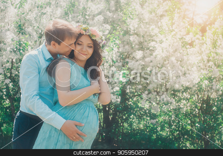 To use this stock image in your creative project, please select the size you need over to the right and click the "Add to Cart" button.
Your downloaded image will come with the Cutcaster watermark removed so don’t worry about the watermark you see on this page. Man hugs his pregnant woman from behind standing in the forest stock photo, Man hugs his pregnant woman from behind standing in the forest by aaalll3110